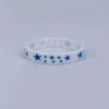 White silicone bracelet with blue accents