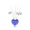 Collana in argento con tre delfini blu