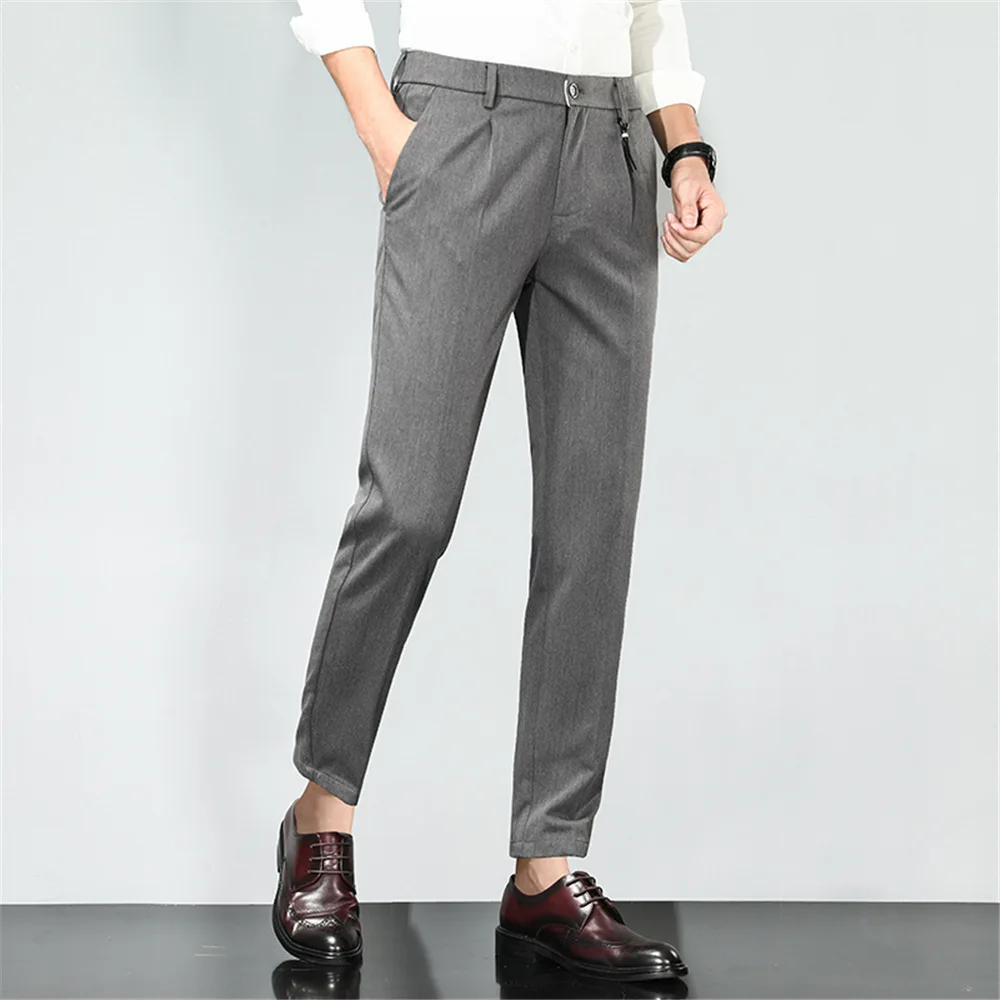 The front crease on pants was a different and new style for mens pants at  the time  Mens pants Pants Khaki pants