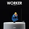 Lavoratore accovacciato - blu