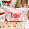 Bolsa de cosméticos estucada con estampado de lazo