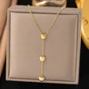 Three heart-shaped pendant stainless steel necklaces
