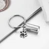 Silver cylinder with dog paws