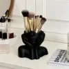 Black pen holder for supporting the face