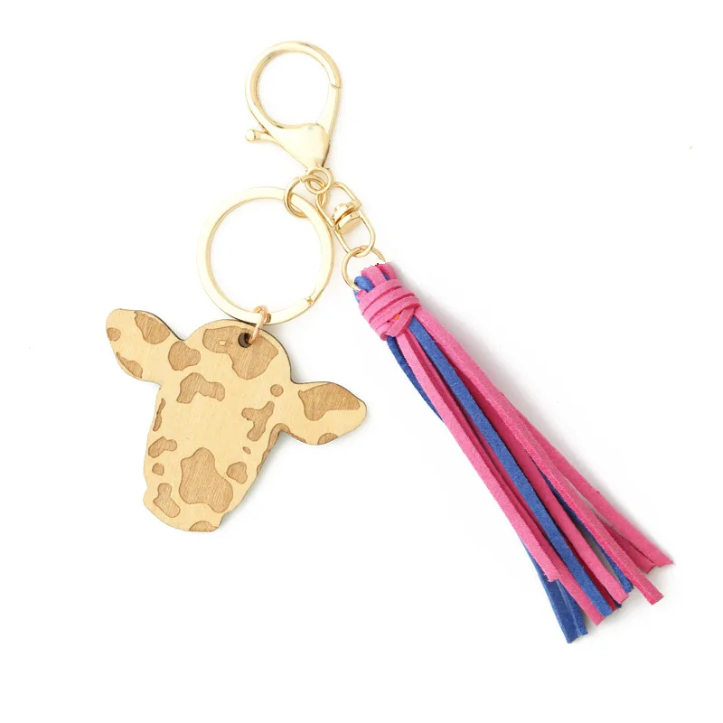 Wholesale Cow Print Leather tassel Cow head wood shavings Charm Tassel  keychain Retro geometric cow shape keyring wristlet From m.