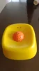 Yellow bowl orange ball