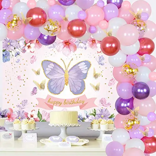 décor du premier anniversaire de la fille. belle zone photo rose pour  petite fille d'un an avec un grand papillon en papier et boules. grosse  lettre numéro un avec des ballons roses.