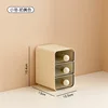 Small, cream-colored [three drawers]