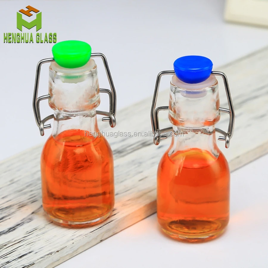 Small Mini 50ml 2oz Round Shape clear Drinks Swing Top Olive Oil Liquid Glass Container Bottle Wholesale
