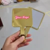 Gold handle mirror