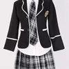 Black top + shirt and tie + gray plaid skirt