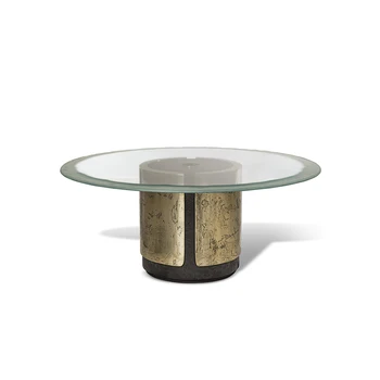 Luxurious round clear glass or marble dining table with cylindrical steel base and golden legs