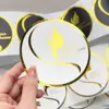 White with gold foil logo