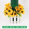 Four bunches of sunflowers on the fence