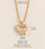 Collana con ciondolo a forma di cuore in oro con diamanti incastonati e portafoto