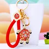 Tortue rouge colorée + corde porte-bonheur rouge vif