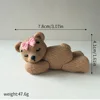 02-orso di peluche scuro in posizione sdraiata-rosa