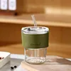 Bamboo-shaped cup with transparent and green lid and straw