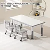 Whiteboard, gray table, two chairs