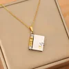 gold-Two-tone book necklace