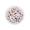 Spherical white and colorful smiley face beads