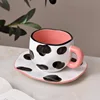Tazza e piattino a pois, bianco e nero