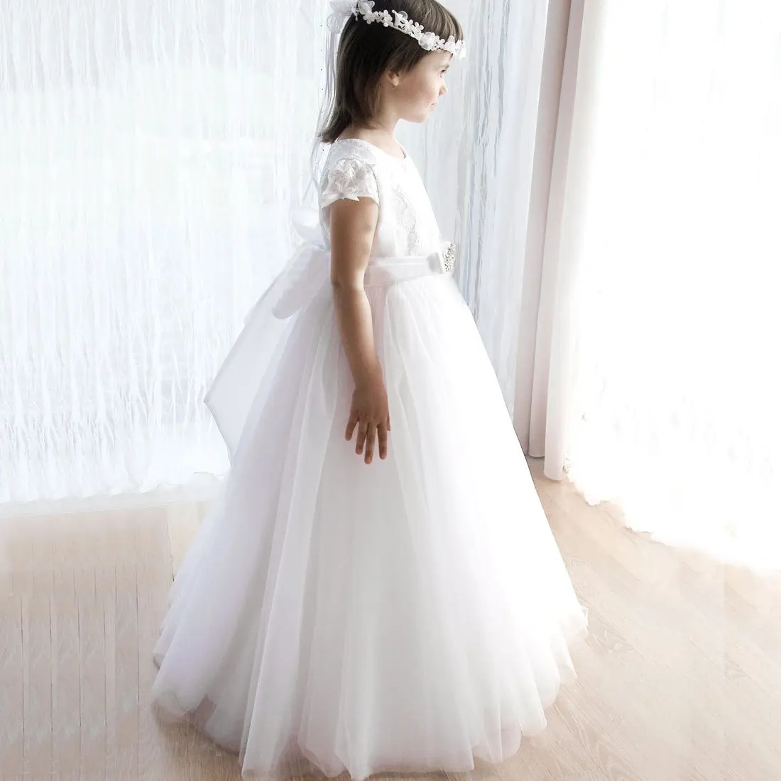 Elegant white soft tulle skirt wedding gown with full sleeve royal bodice