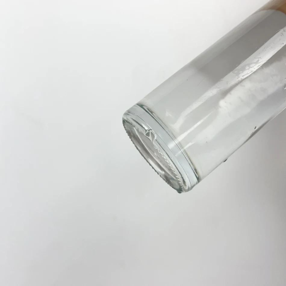 2025 Top Selling clear 70cl Vodka Bottle Round Shape Tequila Gin Bottle Long Neck Wine Whisky Bottle with Wooden Cork Sealing