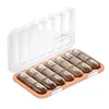 21-compartment pillbox [transparent brown with English labeling]
