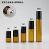 Amber bottle + steel roller ball + plastic black cap