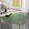 Tapis pour animaux de compagnie en cuir double face - forme de tête de chien minimaliste, vert foncé