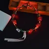 Stile rosso a dieci lampade e nove fiori