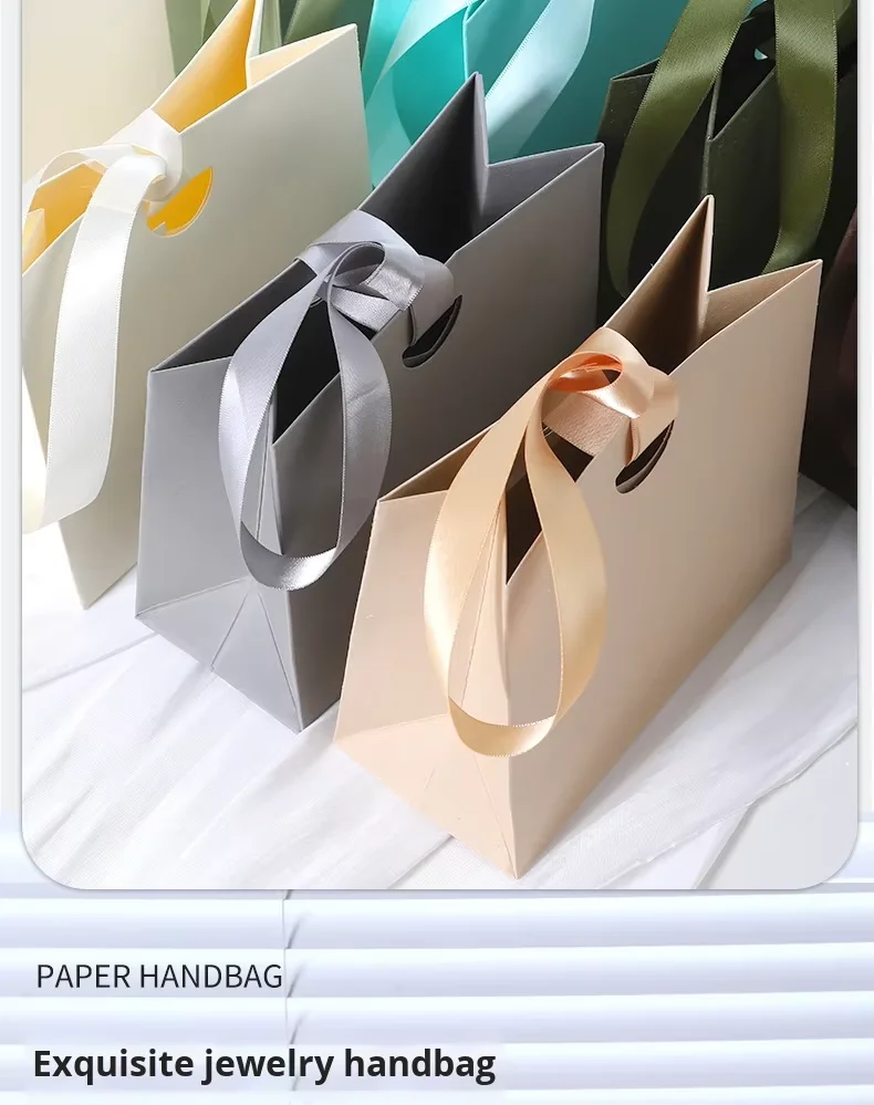 Luxury paper bags with ribbon in coordinated color palette