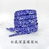 Dark blue crackle pattern on white
