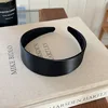 black wide-brimmed headband