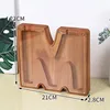 Charcoal-colored boxed M
