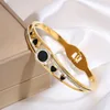 Bracciale in madreperla nera a forma di cuore in oro