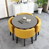Mesa redonda gris + silla de cuero amarillo