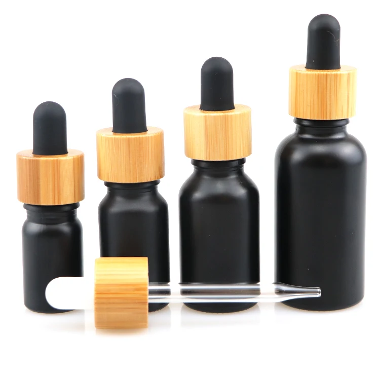 10ml 30ml 50ml cosmetic packaging essential oil dropper bottle glass bottles with wooden cap black glass bottle