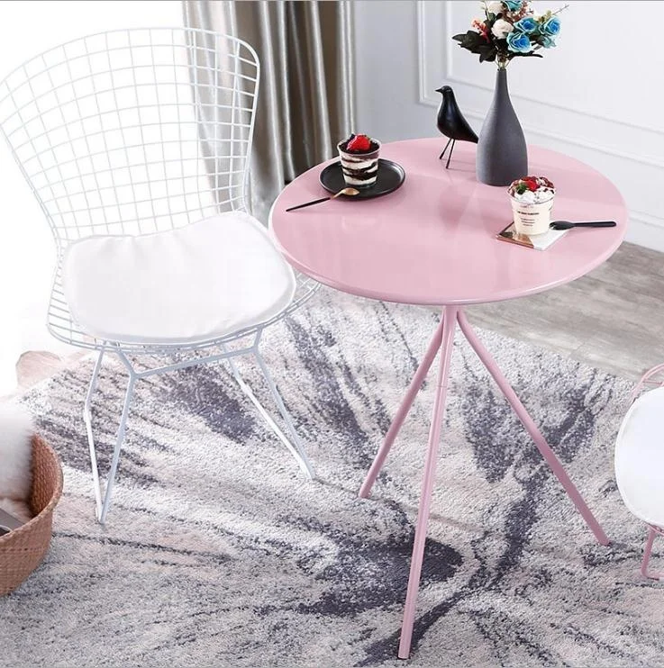 pink metal table and chairs