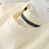 Maglia a maniche corte in tessuto waffle color albicocca con scollo a borsa