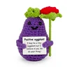 Eggplant holding a rose