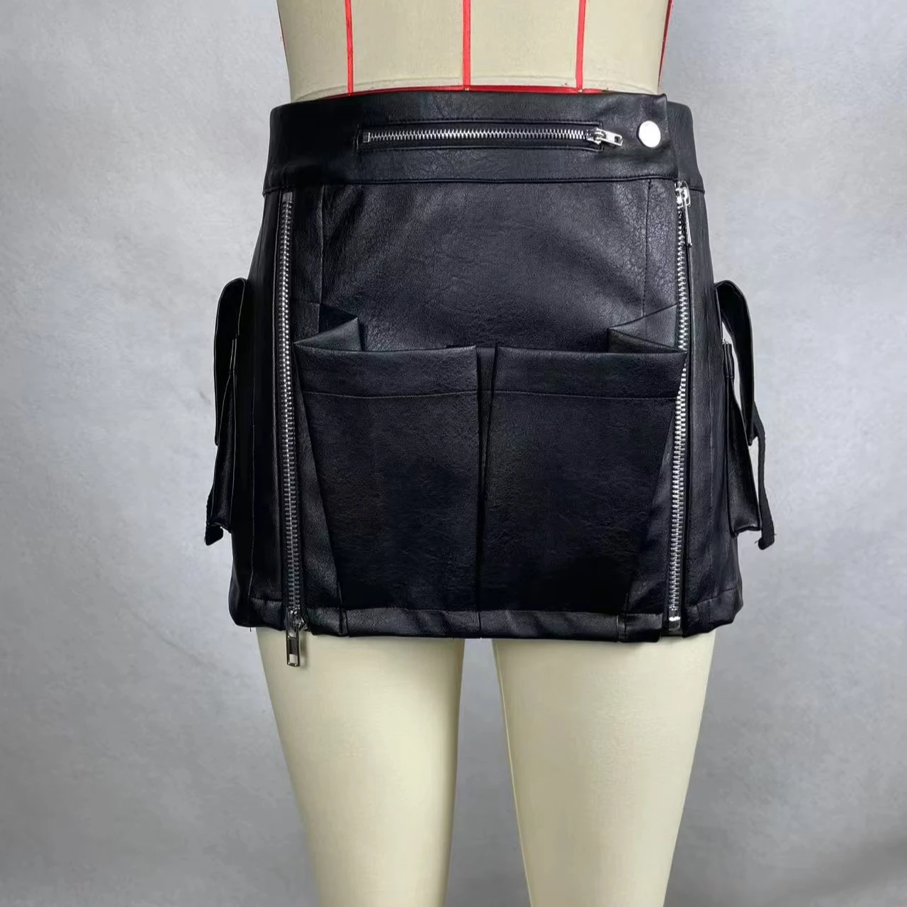 A Trendy, Cool, Short Leather Skirt With Multiple Compartments And Zippers. - Image 1