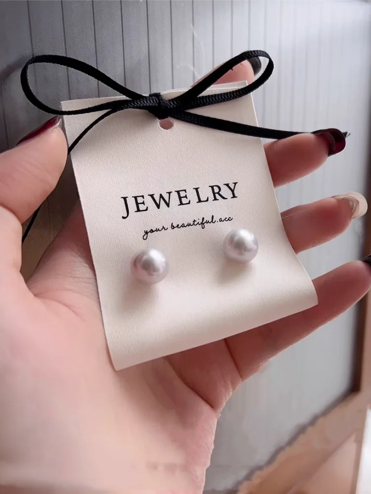 Personalized branding for boutique jewelry packaging Custom logo placement on specialty paper display cards