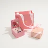 Pink box with paper bag
