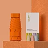 naranja con caja de papel