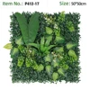 Panel de pared verde con hoja grande, hoja variegada y flor blanca