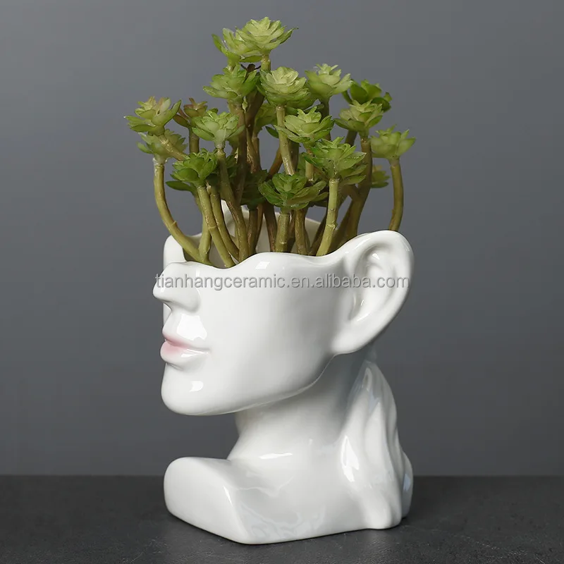 Modern Creative head ceramic black white face home decoration flower arrangement vase.jpg