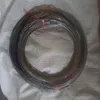 One stainless steel roller with rubber ring and 35 cm diameter.