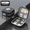 Small 7-compartment black with English labeling